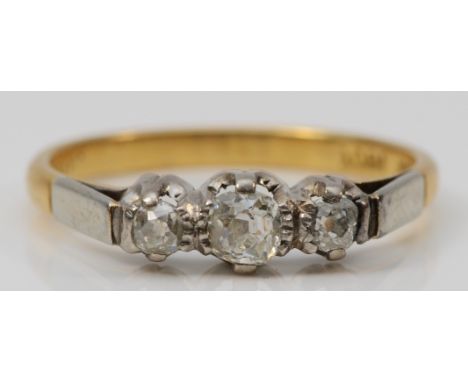 A 18ct gold and three stone old cut diamond ring, stated weight 0.40cts, N, 2.7gm 