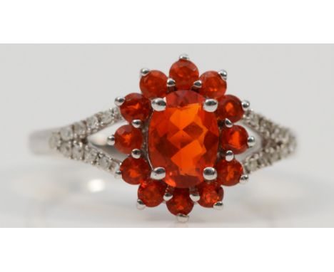 A 9ct white gold fire opal halo dress ring with diamond set shoulders, M 1/2, 2.4g 