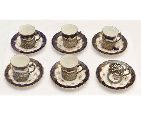 An Edwardian silver mounted set of six Coalport coffee cans with saucers, Sheffield 1908, three cans good, the remainder are 