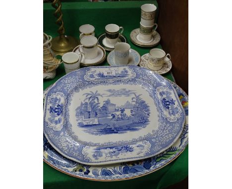 Coffee cans and saucers, a Victorian blue and white meat plate and another.