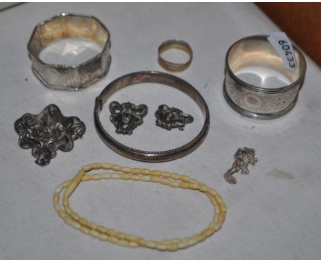 9ct gold ring, 2 silver napkin rings, silver bangle, 3 brooches, etc.