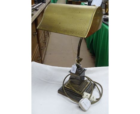 An adjustable Vintage brass desk lamp.