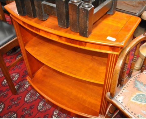 A yewwood bow front open cabinet with adjustable shelf, width 78cm, height 76cm.