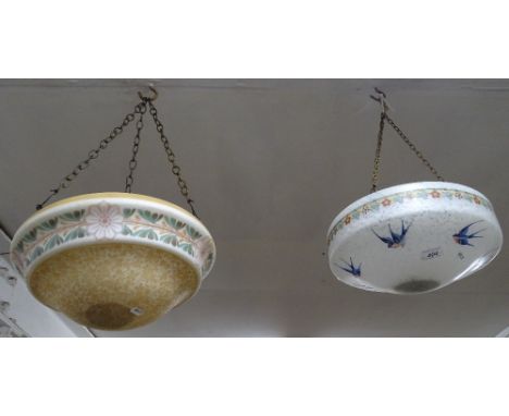 An Art Deco glass ceiling light bowl with swallows decoration and another with floral frieze.