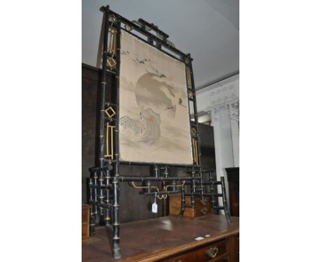 Oriental black lacquered and gilded firescreen with silk panel, width 72cm, height 117cm.