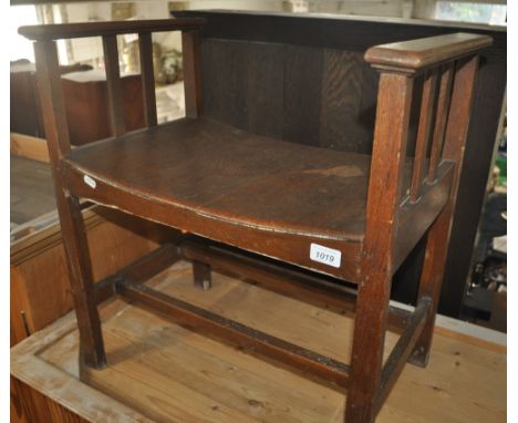 An Arts & Crafts oak stool, width 56cm.