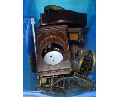 Clock cases, clock movements and a barometer.