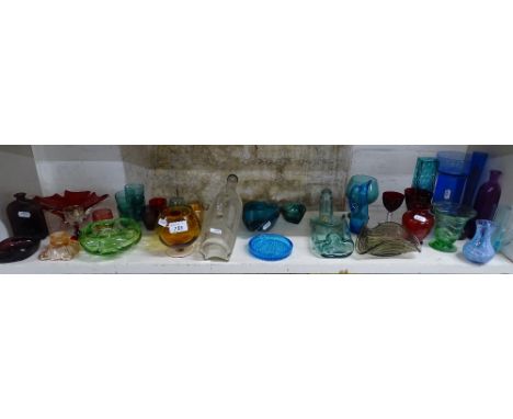 Shelf of decorative glassware.