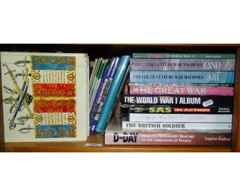 A shelf of books on war and military interest.