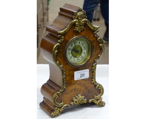 A burr walnut cased mantel clock with gilt metal mounts.