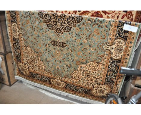 A green ground Keshan carpet, 230cm x 160cm.