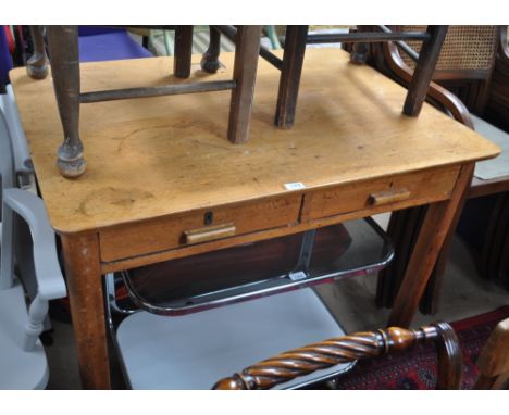 A rectangular 2-drawer writing desk,with fitted inkwell, width 106cm.