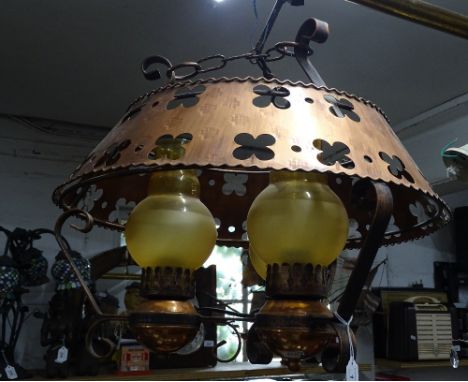 A 3-branch oil lamp style ceiling light with copper shade.
