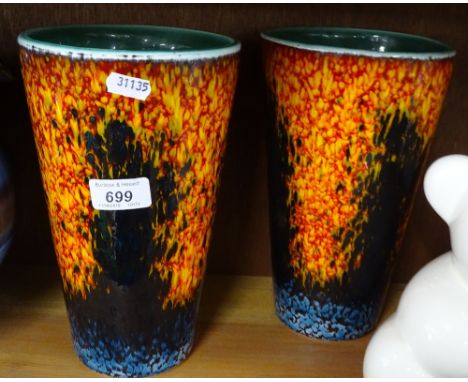 A pair of Poole Pottery vases with painted abstract designs.