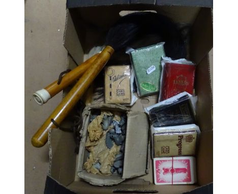 Horse hair fly whisks, a flock of sheep and playing cards.