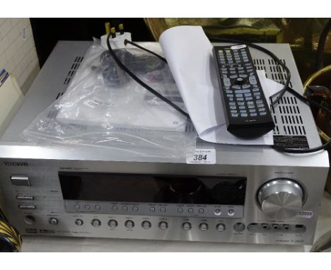 An Onkyo AV receiver complete with remote and manual.