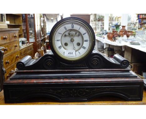A slate mantel clock with 2-train movement.