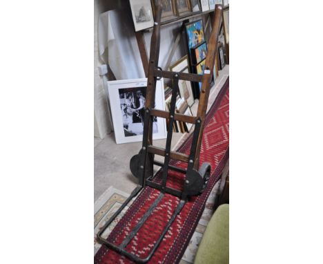A large vintage railway wood and iron sack truck