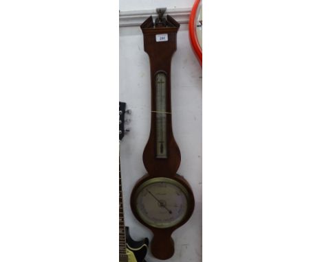 A Georgian mahogany wheel g barometer by L Casartelli, Liverpool.