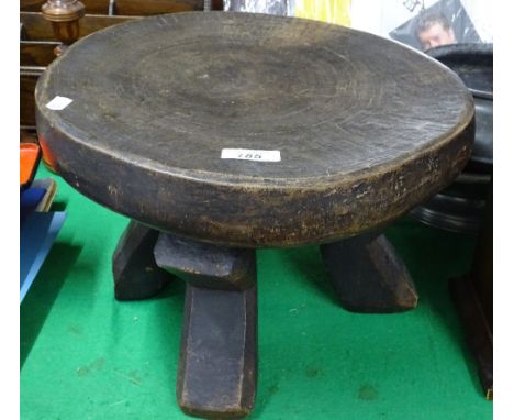 A carved wood tribal stool.