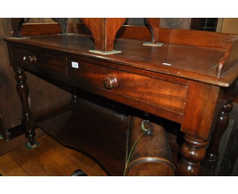 A Victorian mahogany wash stand, with raised back and 2 frieze drawers and shelf below, width 121cm.