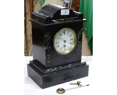 A slate cased mantel clock.
