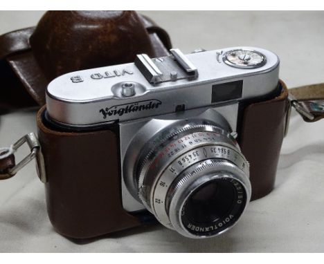A leather cased Voigtlander camera.