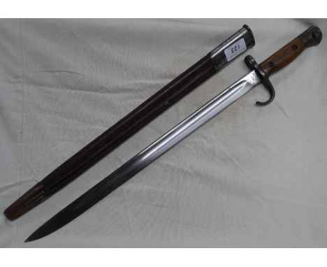 A First World War bayonet with steel scabbard.