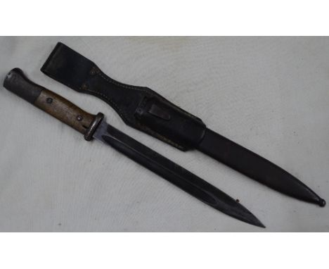 A Second World War German bayonet in scabbard.