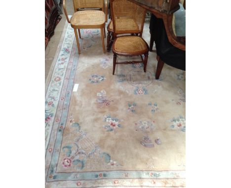 A large cream ground embossed Chinese design carpet, 300cm x 240cm.