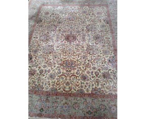 A large cream and green ground Aubusson carpet with symmetrical pattern and border, length 300cm x 245cm.