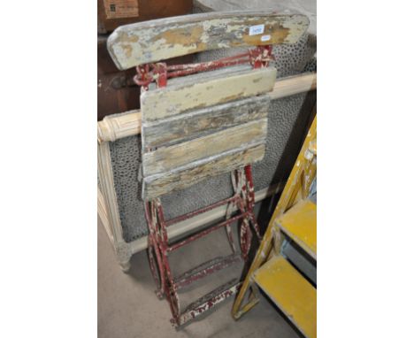 A pair of Vintage folding tennis chairs.
