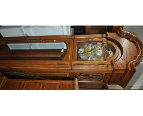 A reproduction American oak 3-train long cased clock, with moonphase arched top dial, by "Sligh" height 6'10".