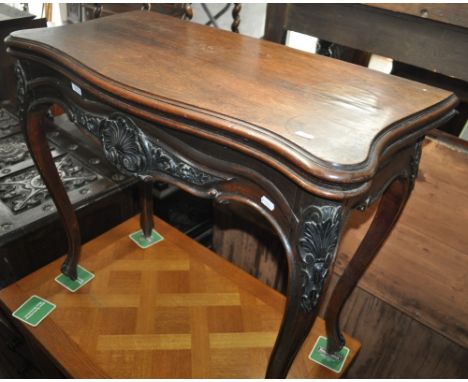 A 19th century rosewood foldover card table, carved cabriole legs, width 82cm.