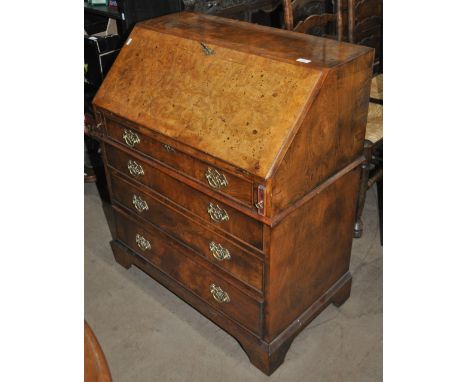 A Georgian style burr walnut bureau, with shaped fitted interior, 4 long drawers under on bracket feet, width 82cm, height 97