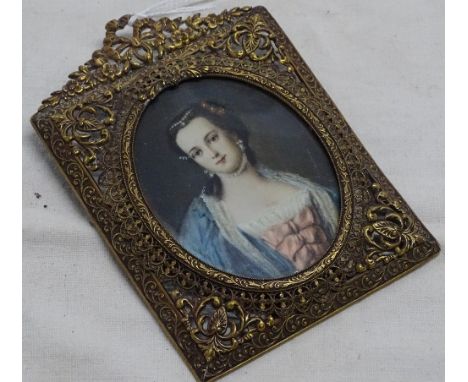 A framed portrait miniature on ivory, pierced gilt metal frame.