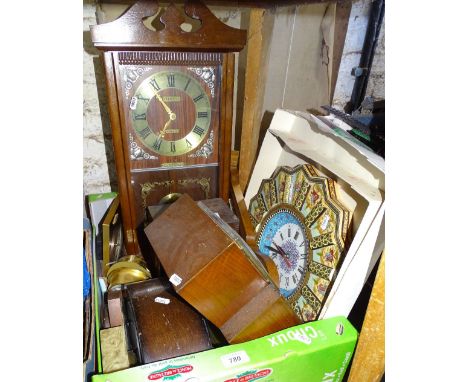 Various mantel and wall clocks.