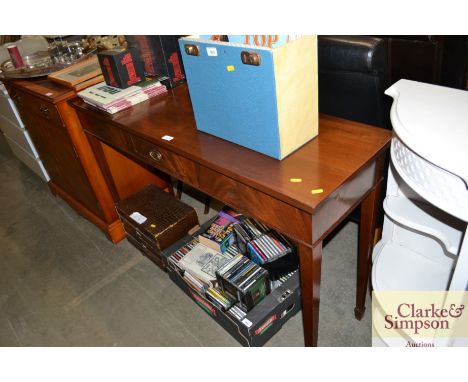 A mahogany console table fitted single drawer raised on square tapering supports