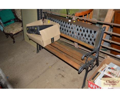 A wooden and metal garden bench