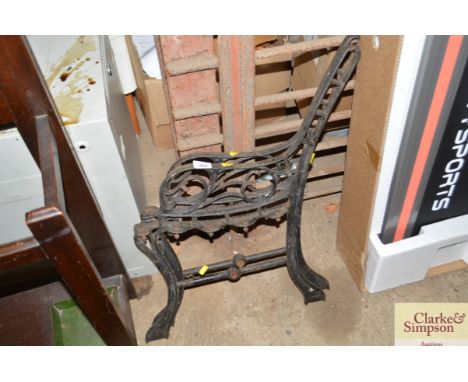 A pair of metal bench ends