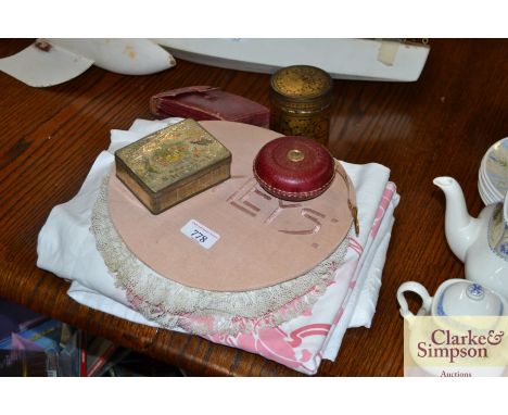 A quantity of doilies, curtains, papier-mâché box,&nbsp;needle case and contents, leather cased tape measure