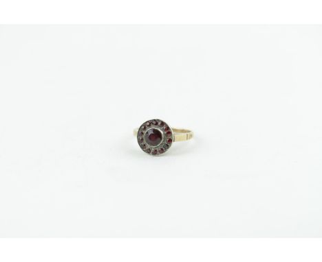 Edwardian Yellow metal Silver Garnet set Circular cluster ring, 2.9g total weight. Size L 