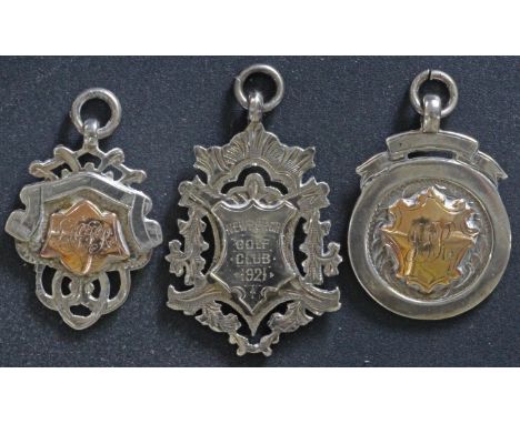 Three solid silver and gold medals from Newburgh Golf Club, Ellon, Aberdeenshire, Scotland. The first medal is engraved "Newb