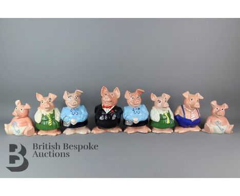 Eight Natwest Wade piggy banks, each with Natwest stoppers. No chips or cracks to items.