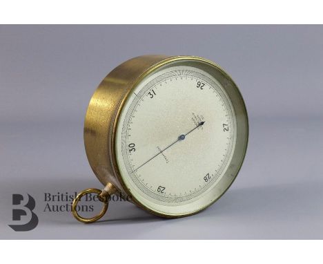 Brass cased Aneroid barometer, stamped T. Wheeler Scientific Institute nr 2131, approx 12 d x 5.2 cms.