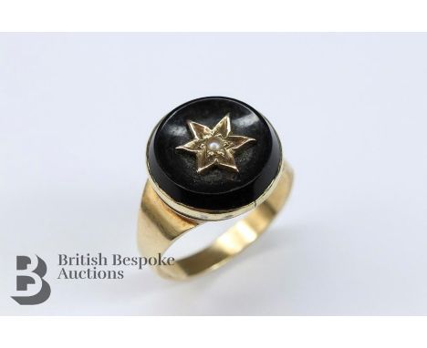 Early 19th century 9ct gold (tested) onyx and seed pearl mourning ring, size P, approx 400 gms.