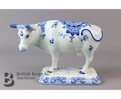 Royal Delft blue cow with decorative floral pattern and EA 1071 marking to base h 10 cm x l 25 cms, with no cracks or chips t