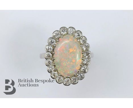 Stunning antique opal and diamond ring, the natural opal approx 14 x 12 mm, surround by approx 95 pts of old-cut dias, set in