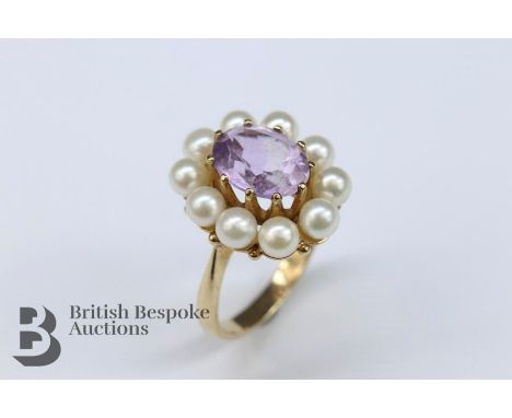 9ct gold amethyst and seed pearl dress ring, the amethyst approx 10 x 8 mm, surrounded by 10 4mm pearls, size L, approx 5 gms