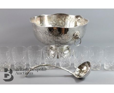 Silver plated punch bowl and ladle, chased foliate decoration and lion mask handles, approx 32 d x 20 h cms together with an 